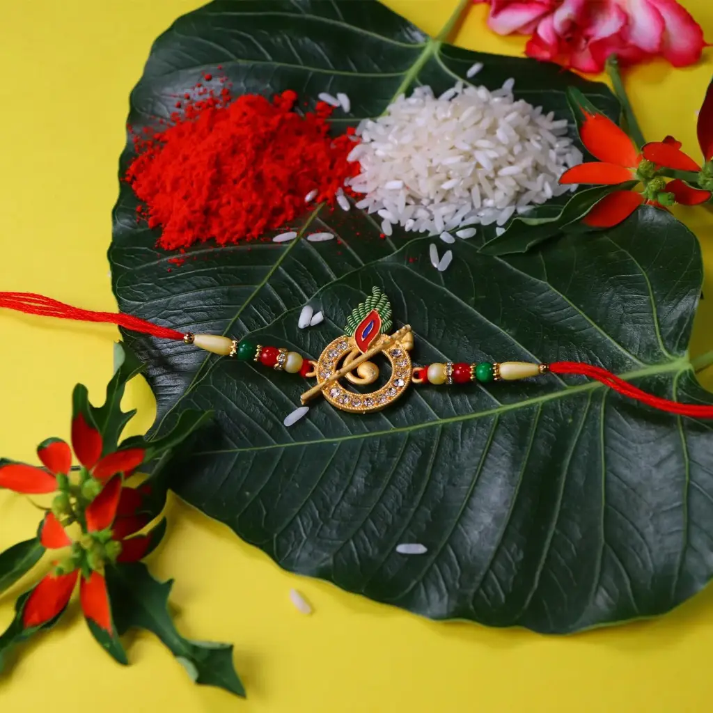 DeoDap  Designer Murli Flute Rakhi for Brother with Choco Coated Nut Butterscotch Chocolate 96gm, Pooja Coin, Roli Chawal & Card | Rakhi with Chocolate Combo for Raksha Bandhan